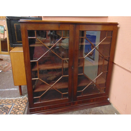 382 - Antique mahogany bookcase, caddy form cornice, pair of astragal glazed doors enclosing a shelf lined... 