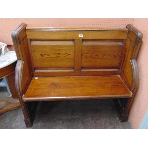 384 - Small pitch pine pew, having panel back and brass side handles. 37 x 40 x 18