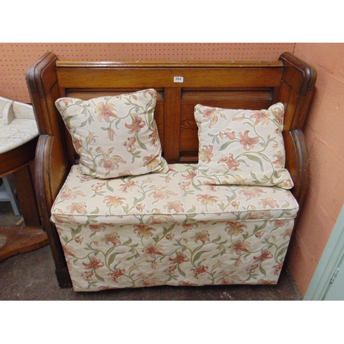 384 - Small pitch pine pew, having panel back and brass side handles. 37 x 40 x 18