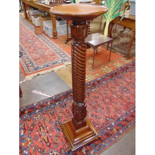 386 - Mahogany jardiniere stand, circular dish top, set on twist column and platform base. 45