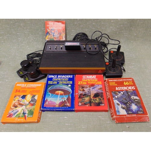 427 - An Atari games console, with games.