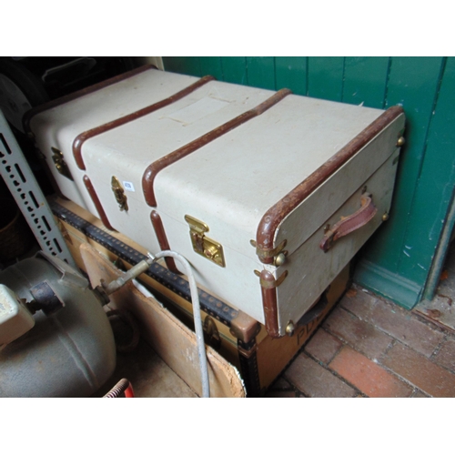 459 - Two metal bound travel trunks.