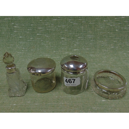 467 - Silver mounted scent bottle, two silver mounted dressing table jars and a large silver mounted glass... 