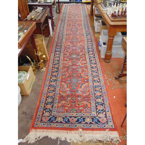 469 - Long Persian red and blue ground runner, having geometric pattern, 203 x 40