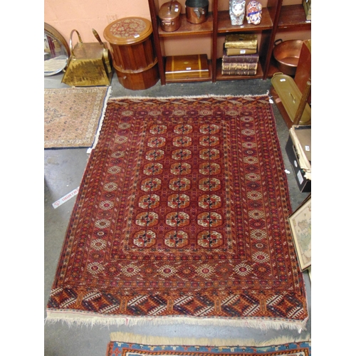 47 - Persian red ground rug, having geometric pattern, 66 x 55