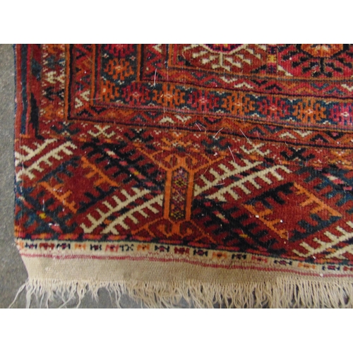 47 - Persian red ground rug, having geometric pattern, 66 x 55