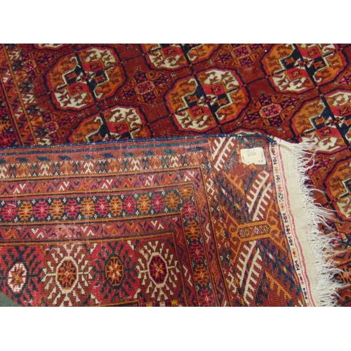 47 - Persian red ground rug, having geometric pattern, 66 x 55