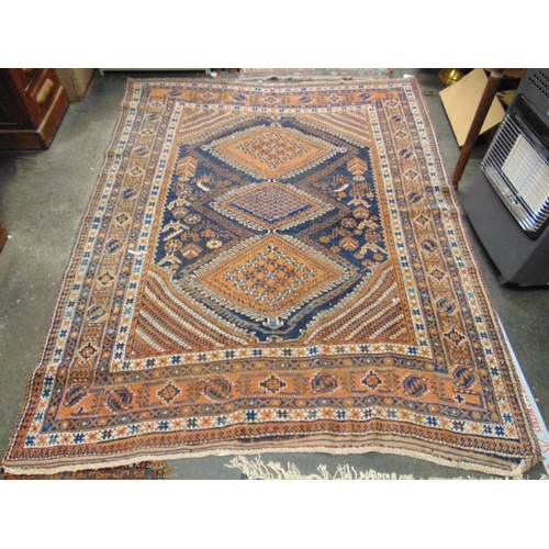 49 - Persian blue and orange ground rug, having geometric pattern. 74 x 58