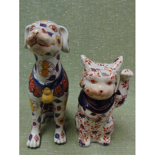 55 - Imari style pottery dog and a similar cat.