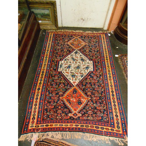 37 - Persian red, blue and yellow ground rug, having geometric pattern, 61 x 42