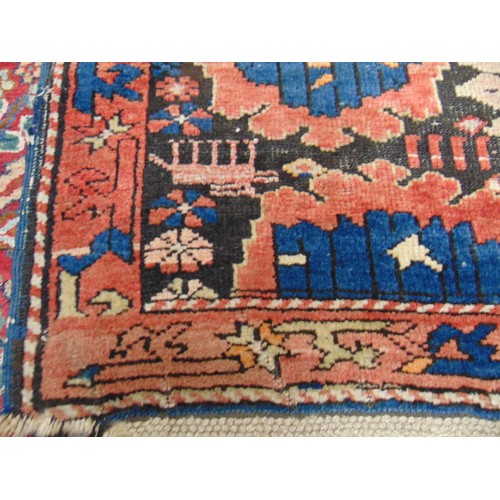 372 - Persian red and blue ground rug, having geometric pattern, 102 x 47