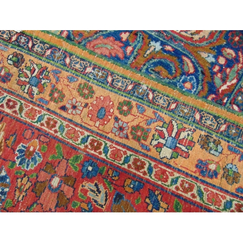 21 - Persian blue, red and pink ground rug,  having geometric floral pattern, 150 x 107