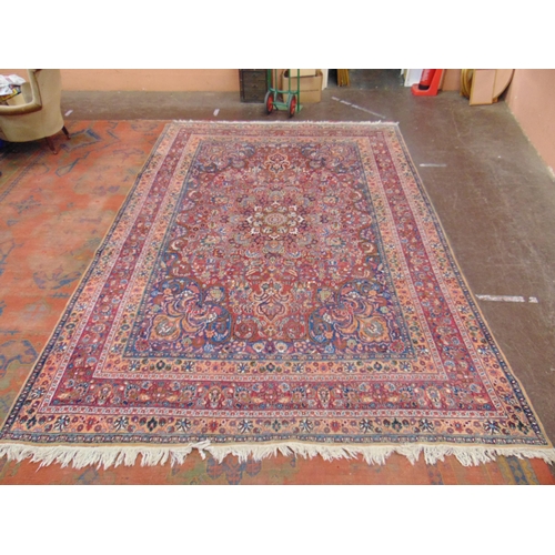 21 - Persian blue, red and pink ground rug,  having geometric floral pattern, 150 x 107