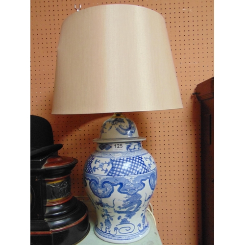 125 - Reproduction blue and white oriental table lamp and shade, 24