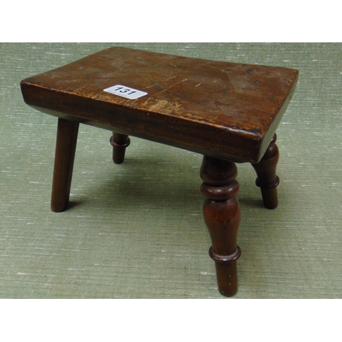 131 - Antique milking stool, rectangular top and on three turned legs. 7.5