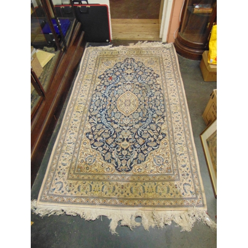 58 - Good Persian blue and fawn ground rug, having geometric floral pattern. 86 x 50