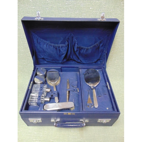 139 - Cased Mappin and Webb silver dressing table set.