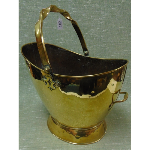 153 - Antique brass helmet shaped coal scuttle, having swing handle, 20