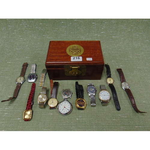 216 - An oriental trinket box, containing a collection of watches.