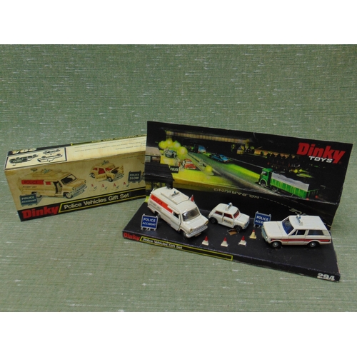 238 - Boxed Dinky Police vehicles gift set, 294.