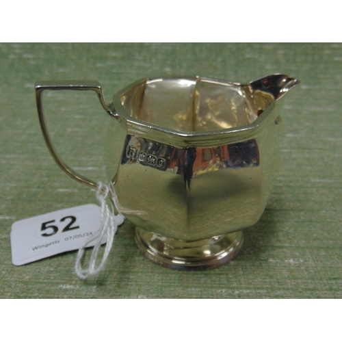 52 - Silver cream jug, having loop handle and of panel form, set on circular footed base, maker Thomas Br... 