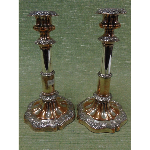 537 - Pair of antique plated candle sticks.