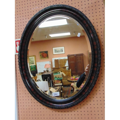 541 - An oval bevel edged wall mirror, 23