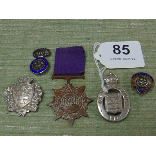 85 - 1915 On War Service cap badge, two others and a medal.