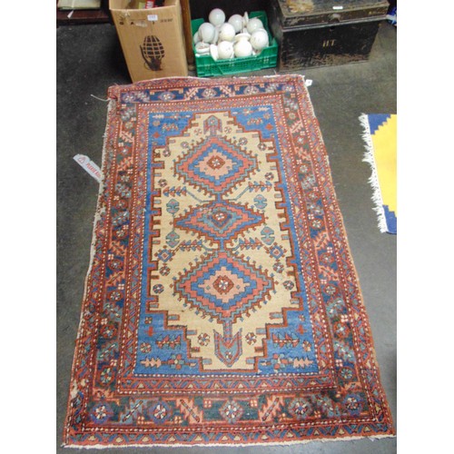 14 - Persian blue and red ground rug, having geometric pattern, 60 x 37