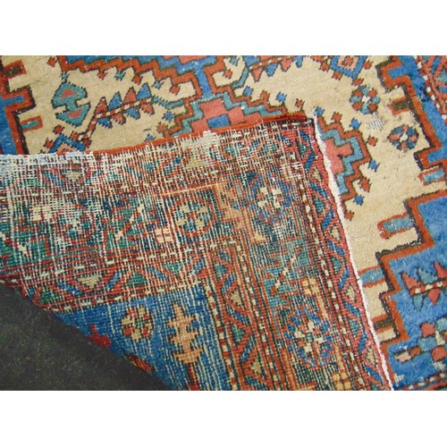 14 - Persian blue and red ground rug, having geometric pattern, 60 x 37