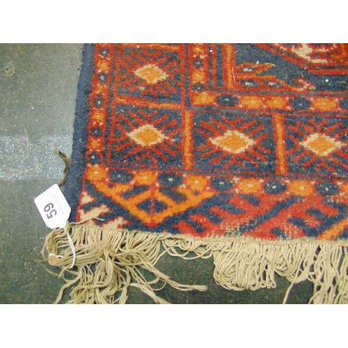 59 - Red and orange ground rug, having geometric pattern, 37 x 25