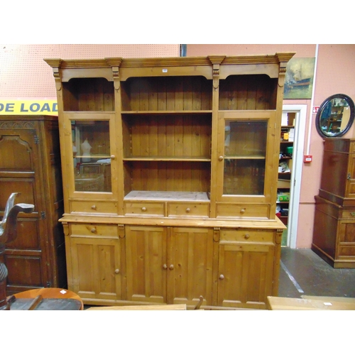 368 - Large reproduction pine dresser, ogive inverted breakfront cornice, triple open recess, shelf lined ... 