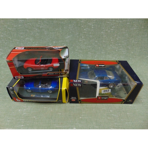 262 - Two boxed burago collectable model vehicles and one other example. (3)