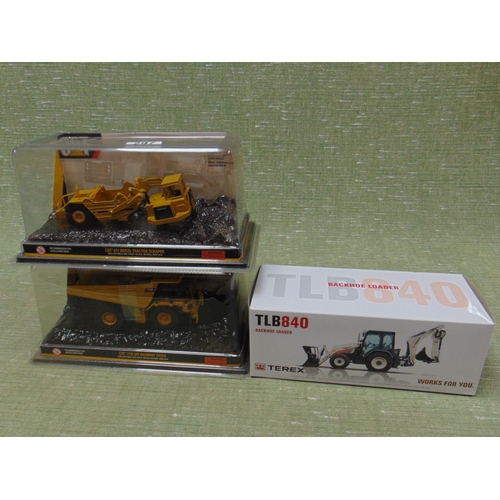 297 - Three boxed collectable model vehicles.