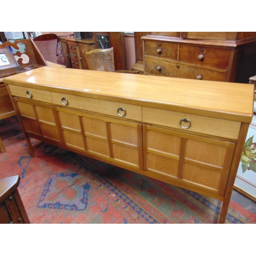 344 - Mid century teak sideboard, three long drawers with ring handles, four panel doors  and on tapered s... 