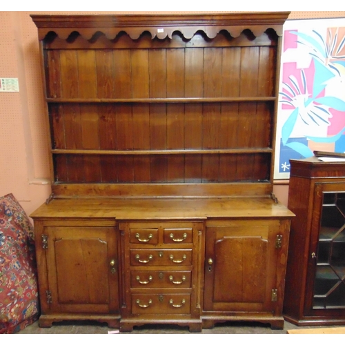 363 - Antique Welsh oak Anglesey dresser, ogive cornice above shaped frieze and pair of shelves, the break... 