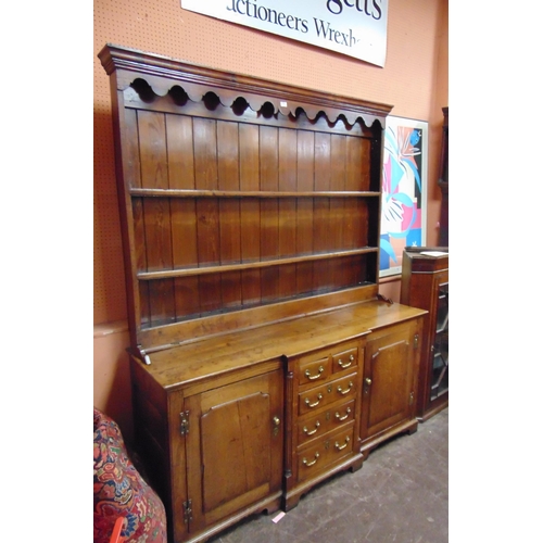 363 - Antique Welsh oak Anglesey dresser, ogive cornice above shaped frieze and pair of shelves, the break... 