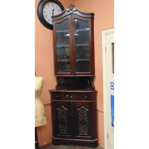 371 - A tall late 19th century mahogany corner cupboard, glazed upper portion, three short drawers and two... 