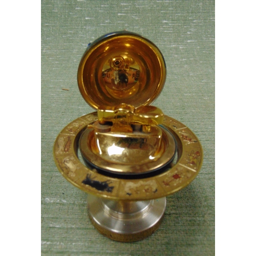 376 - Novelty astrological globe form table lighter.