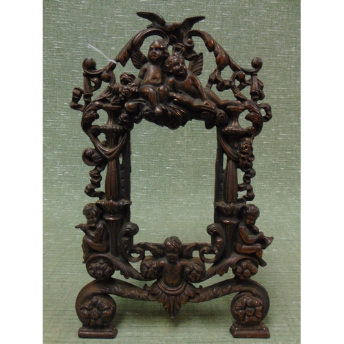 441 - Ornate cherub decorated photograph frame, 6 x 3.5