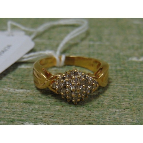 51 - Ladies cluster ring, marked 18 K .