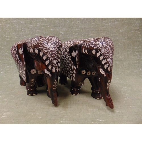 65 - Pair of Eastern Moorish type wooden elephant figures.