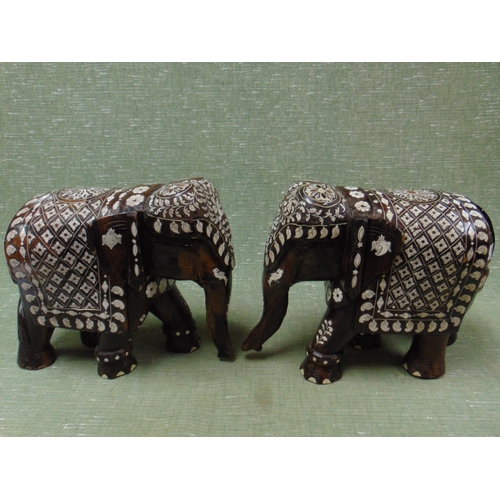 65 - Pair of Eastern Moorish type wooden elephant figures.