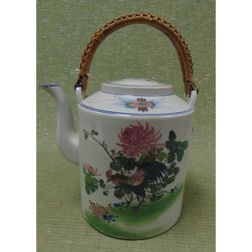 173 - Oriental tea pot, having wicker handle, traditional decoration. 10