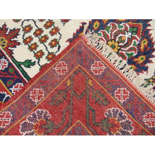 1 - Persian red and blue ground rug, having geometric floral pattern. 120 x 92