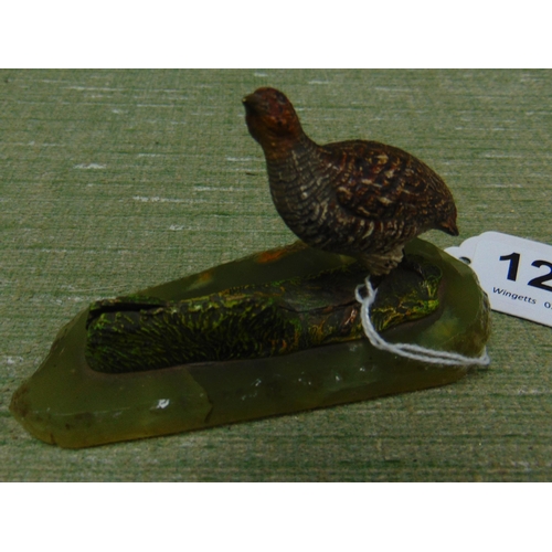 121 - Cold painted bronze grouse figure, set on an onyx base.