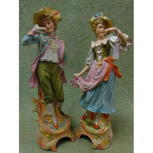 5 - Large pair of continental bisque china figures, Man and Woman, each 20