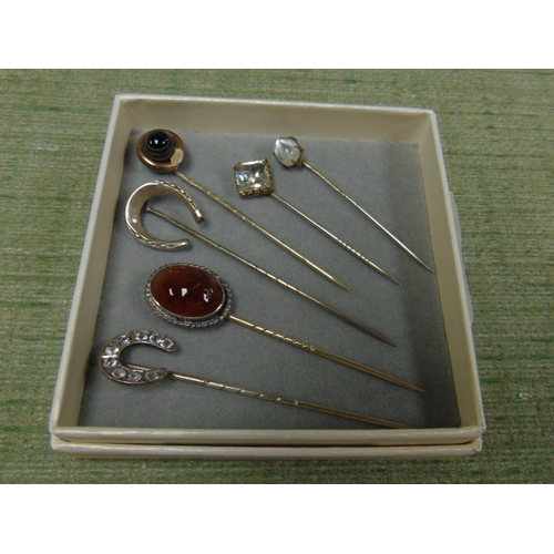 166 - Six antique stick pins.