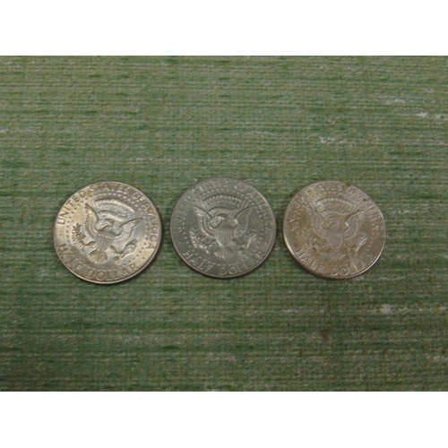 183 - Three silver USA Kennedy half dollars, 1964, 1968 & 1974.