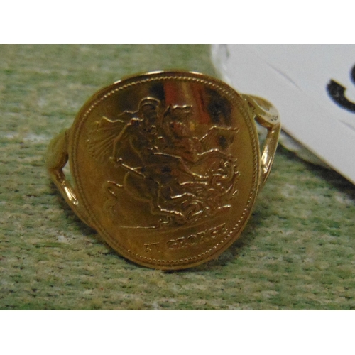 36 - 9ct gold ring, set with a 1976 St George coin, 2.4 gms.